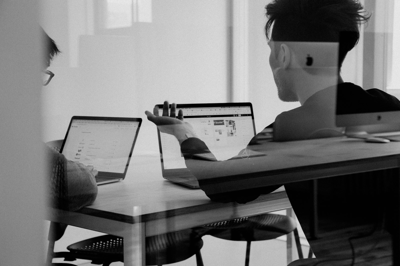 Advisors reviewing business information in a focused working session