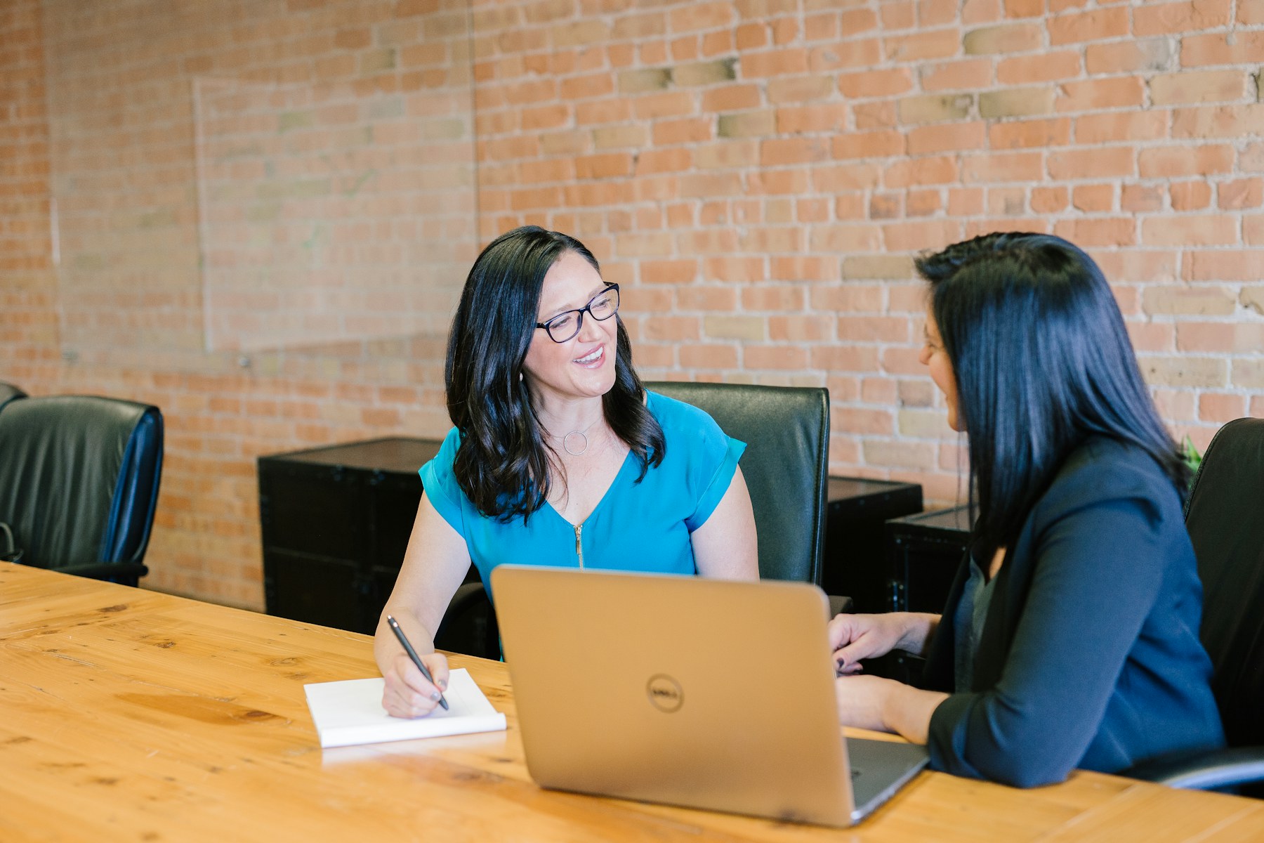 Consultant and business owner reviewing strategic priorities