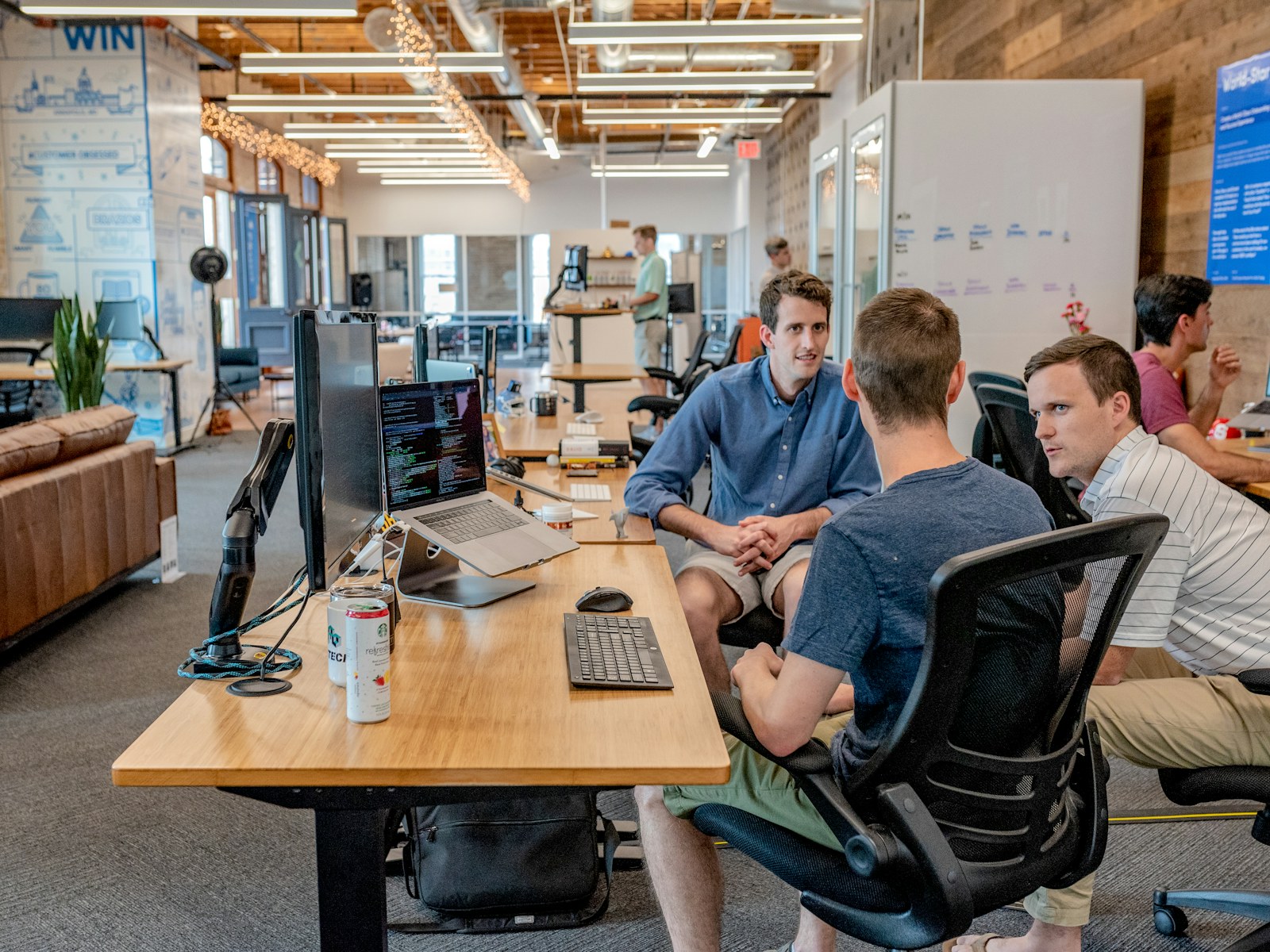 Management team discussing priorities in a modern office