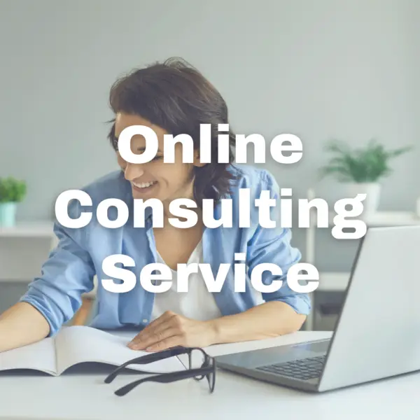 A woman sitting at a desk, smiling as she works with a notebook and laptop, suggesting a virtual or online consulting session. Glasses rest on the desk next to her. The text 'Online Consulting Service' is prominently displayed over the image, highlighting the service being offered.